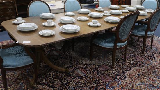 A George III style mahogany twin pillar dining table, extends to 10ft x 3ft 8in. H.2ft 3in.